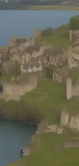 Medieval cliffside castle overlooking a serene blue lake.