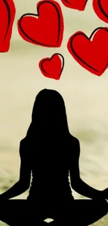 Silhouette meditating with red hearts in tranquil mobile wallpaper.