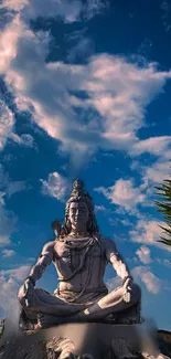 Shiva meditating under a blue sky, surrounded by clouds.