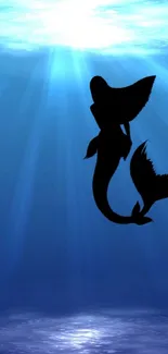 Mermaid silhouette in blue underwater scenery, perfect for iPhone wallpaper.