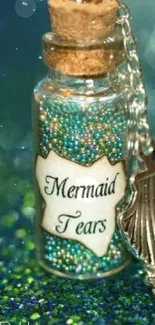 Glittering mermaid-themed bottle labeled 'Mermaid Tears' with seashell charm.