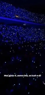 Concert arena filled with vibrant blue lights creating a dazzling effect.