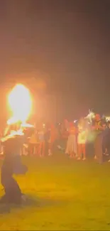 Performers showcasing a fire dance at night