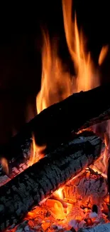 Live wallpaper of burning logs with vibrant flames and embers.