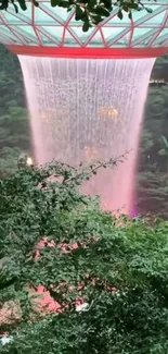 Stunning indoor waterfall with lush greenery and vibrant colors.