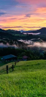 Beautiful sunset view over misty mountains with vibrant sky.