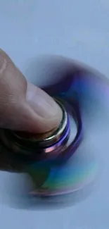 Close-up of a spinning fidget spinner with vibrant colors and high motion blur.