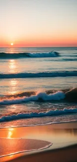 Sunset beach wallpaper with ocean waves and golden sand reflecting the evening glow.