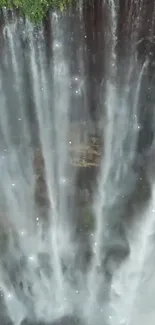 Mesmerizing waterfall with cascading water and lush greenery.