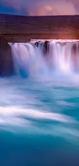 Tranquil waterfall with blue waters, perfect for mobile wallpaper.