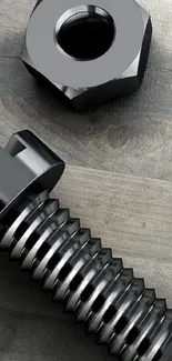 Metallic bolt and nut on a textured wooden surface.