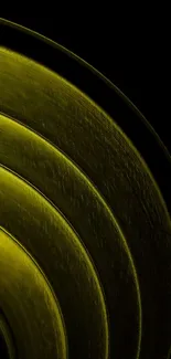 Metallic gold concentric circles on dark background.