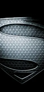 Metallic superhero emblem on a black background wallpaper.