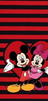 Mickey and Minnie Mouse on striped red and black wallpaper.