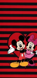 Mickey and Minnie Mouse with heart on a striped red and black background.