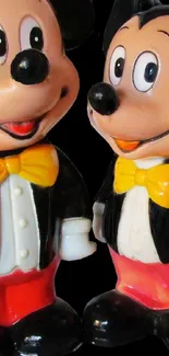 Cartoon figures in tuxedos on black background.