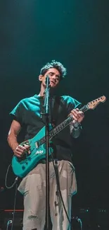 Guitarist performing live on stage under blue lights.