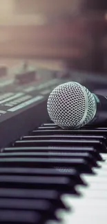 Microphone resting on piano keyboard with soft light background.