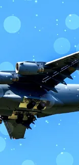 Military jet flying against a bright blue sky.