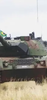 Military tank in a field with camouflage detail.