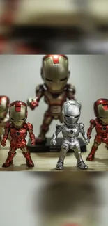 Miniature Iron Man figures in vibrant red and gold.