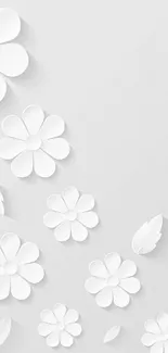 Minimal white floral wallpaper with paper-cut flowers.