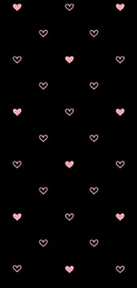 Minimal black phone wallpaper with pink heart pattern.