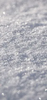 Close-up of shimmering white snow texture, perfect for a calm phone wallpaper.