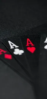 Stylish ace playing cards on black background wallpaper.