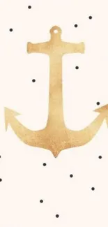 Golden anchor with black polka dots on white background.