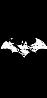 Black and white Batman logo on black background.