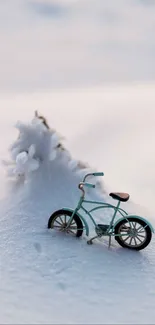 Minimalist bicycle resting in a snow-covered landscape.