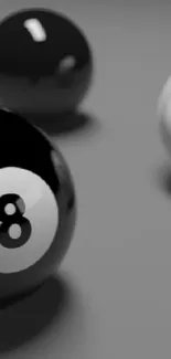 Minimalist wallpaper featuring black and white billiard balls on a gray background.