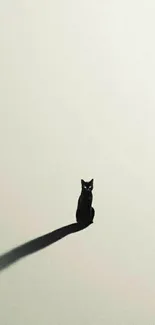 Minimal black cat silhouette on soft beige background wallpaper.