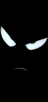 Minimalist black wallpaper with glowing eyes and bold face design.