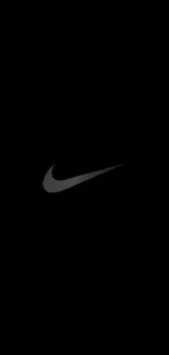 Minimalist black wallpaper with a sleek swoosh design.