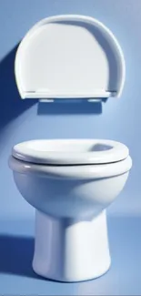 Minimalist white toilet against soft blue background wallpaper.