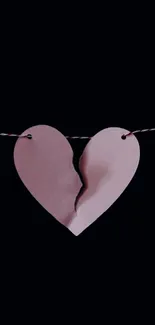 Minimalist dark wallpaper with broken heart art.