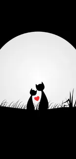 Silhouette of two cats by a moon with a heart detail against a black background.