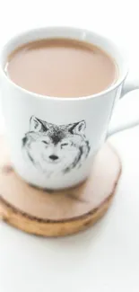 Minimalist coffee cup with wolf sketch on a wooden coaster.