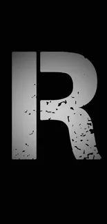 Grunge letter 'R' on minimalist black wallpaper.