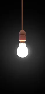 Minimalist wallpaper featuring a light bulb on a black background.