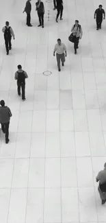 Black and white cityscape with people walking.