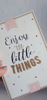 Minimalist wallpaper with motivational quote 'Enjoy the Little Things' in elegant design.