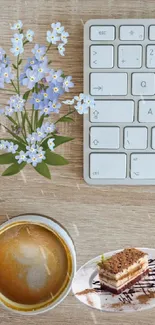 Minimalist office desk setup with coffee and flowers.