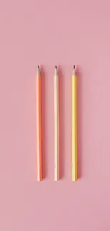 Minimalist pastel pencils on pink background wallpaper.