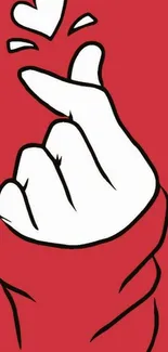 Minimalist red wallpaper with a white hand making a finger heart.