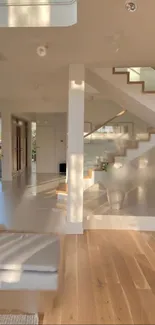 Minimalist interior with sunlit staircase and wooden flooring.