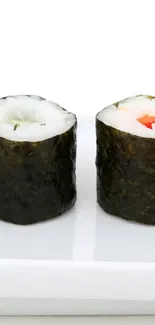 Minimalist sushi rolls on a sleek white plate wallpaper.
