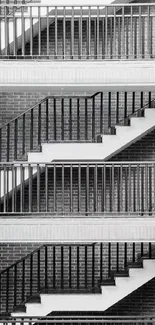 Black and white urban staircase with brick wall.